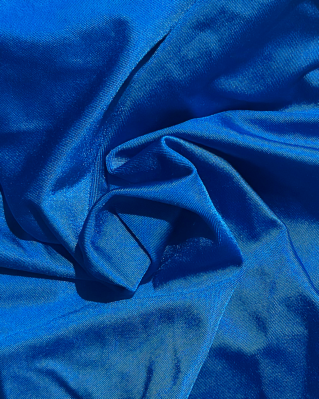 Close-up of royal blue fabric with folds