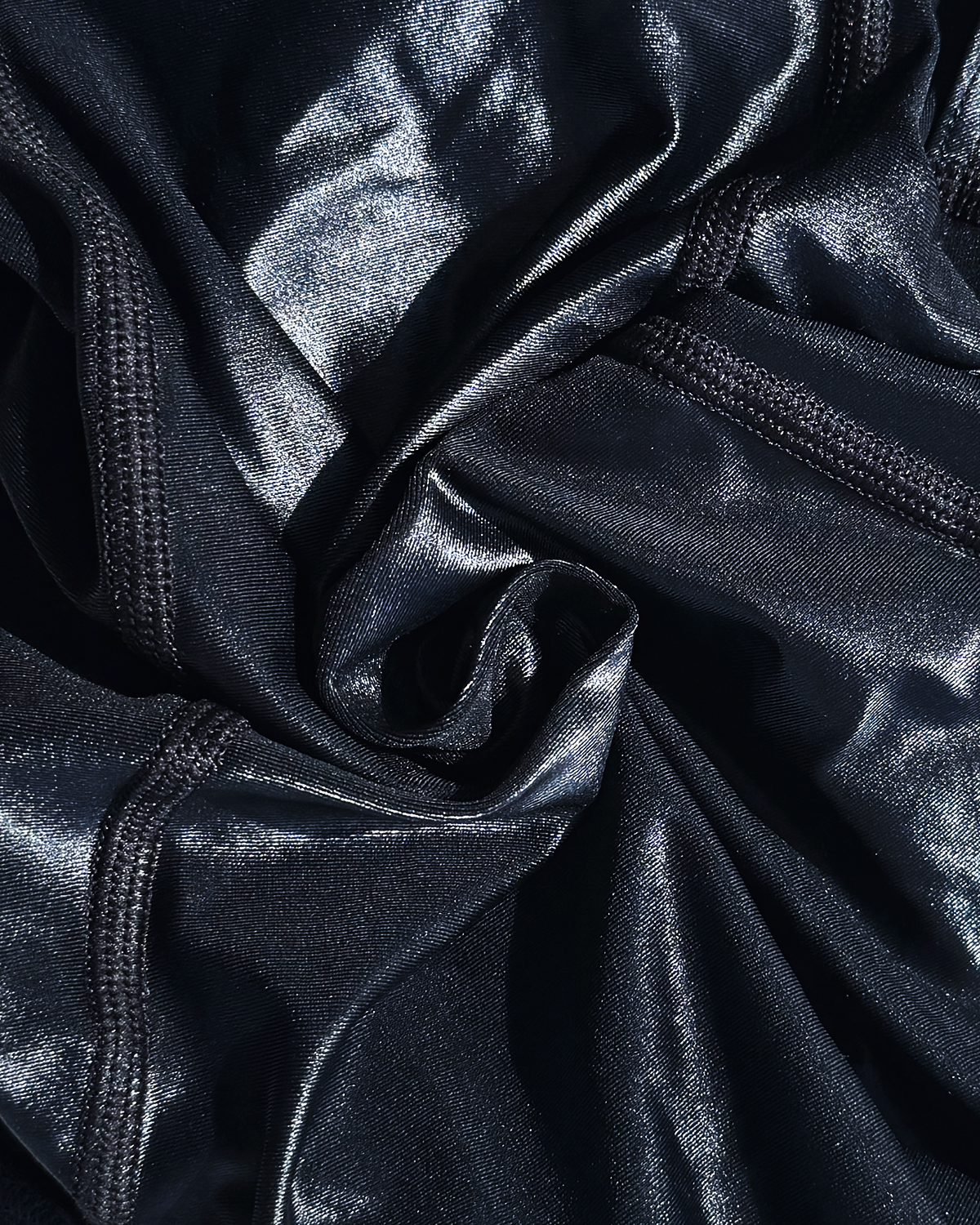 Close-up of black shiny wet look lycra fabric