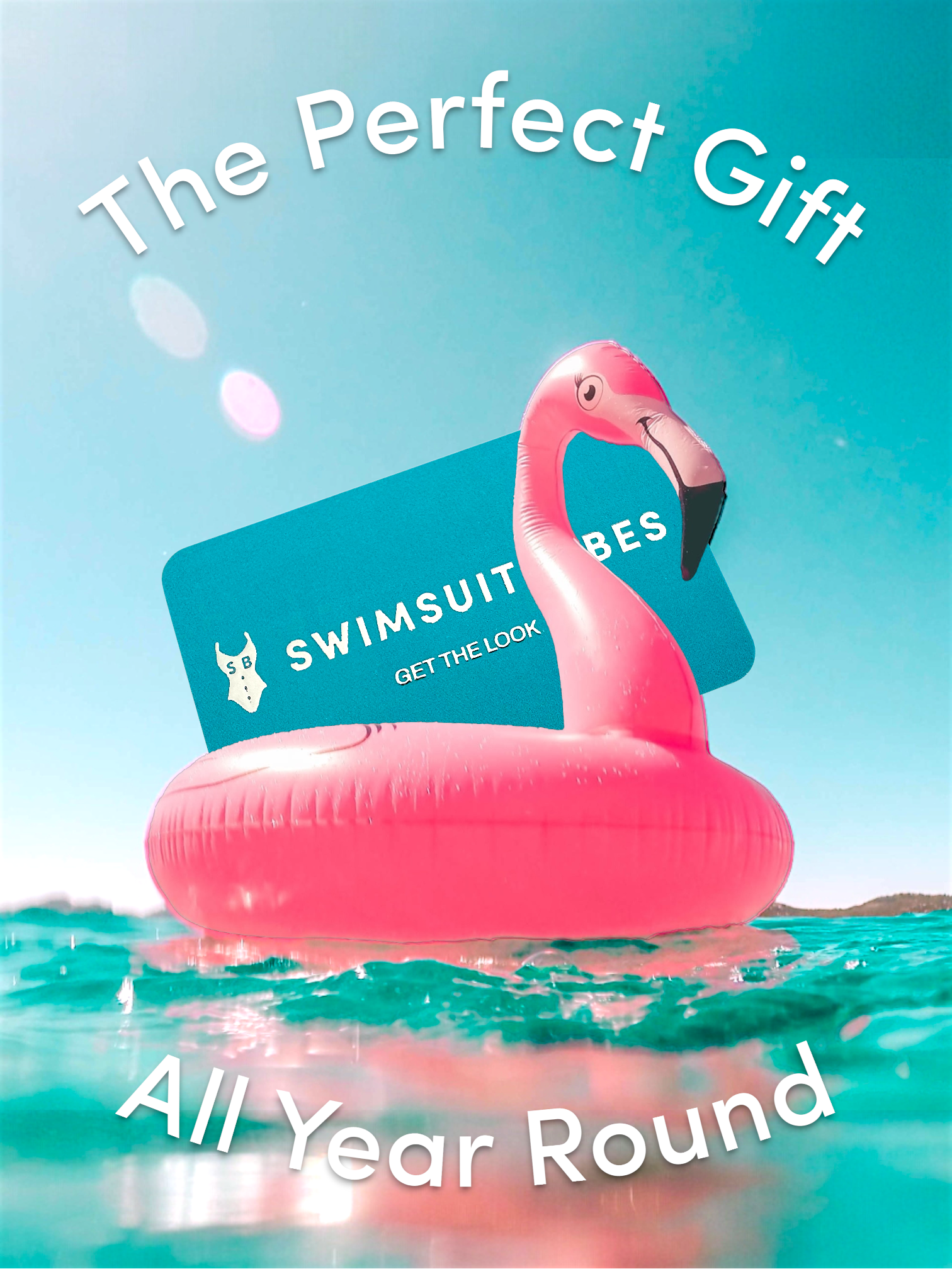 Pink flamingo inflatable pool float with a gift card on top, floating in water with text 'The Perfect Gift All Year Round' and 'Swimsuit Babes'.