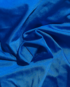 Close-up of royal blue fabric with folds