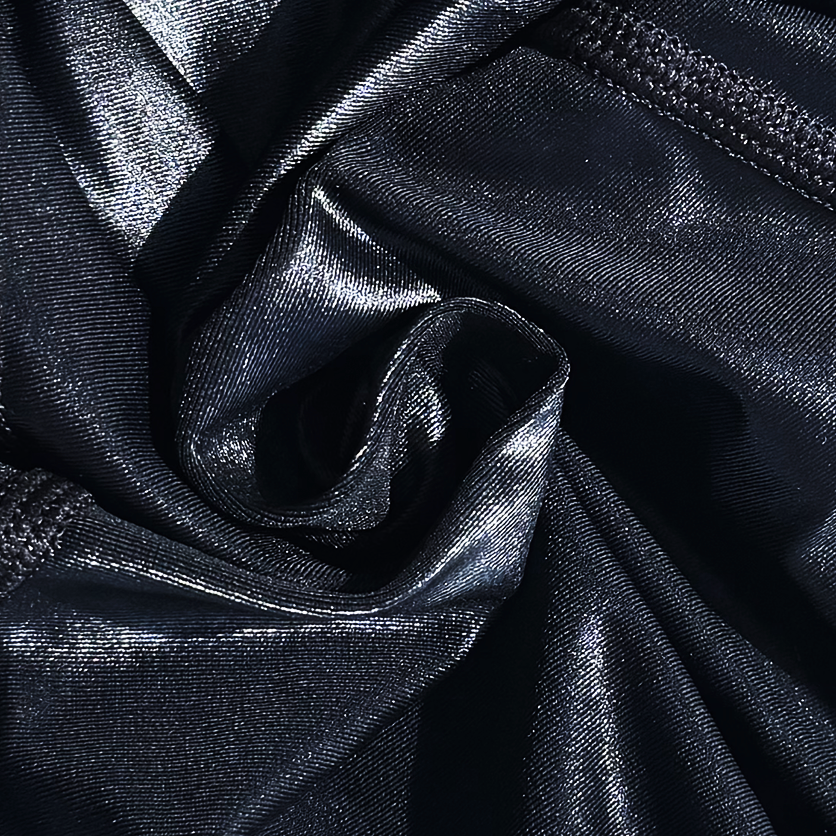 Close-up of black wetlook lycra with folds